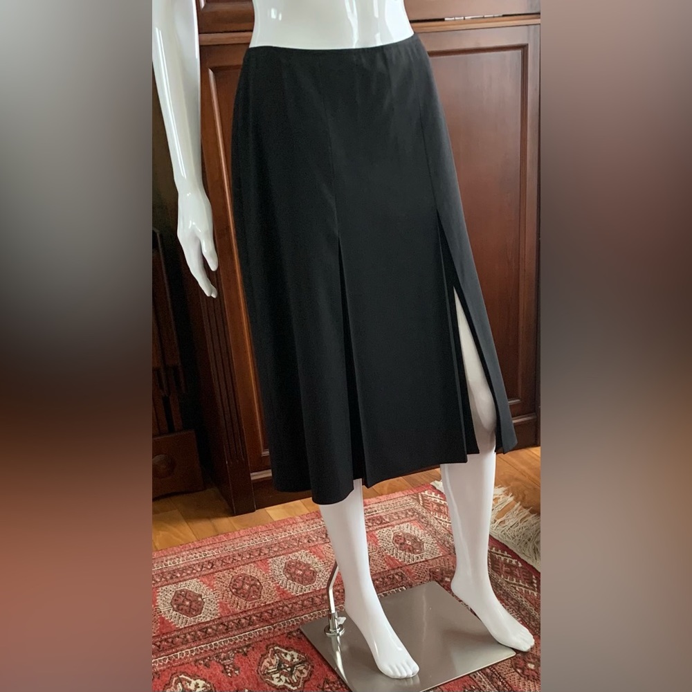 Black 96% fine wool skirt at knee length with four long pleaded sexy slits US 12
